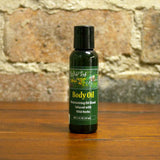 Picture of our 2 oz Body Oil in a Disc top cap
