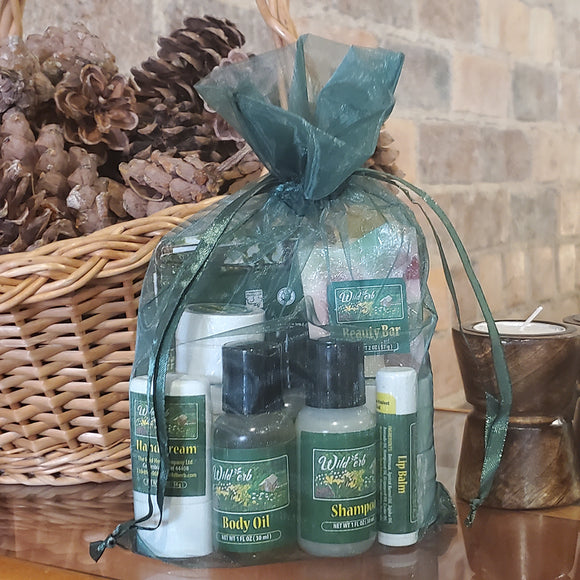 Our sampler bundle comes in a dark green organza bag and contains 11 different sample sizes of our natural products